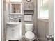 Charming bathroom featuring updated fixtures, cabinet storage, and a medicine cabinet at 2064 Elizabeth Ave, Hickory, NC 28602