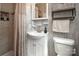 Bright bathroom featuring an updated sink and vanity, medicine cabinet, and a shower at 2064 Elizabeth Ave, Hickory, NC 28602