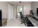 A well-lit bedroom features neutral walls, carpet flooring, a closet, and a window with natural light at 2064 Elizabeth Ave, Hickory, NC 28602