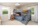 Well-lit bedroom with fun bunk beds featuring built in stairs and storage, perfect for a room at 2064 Elizabeth Ave, Hickory, NC 28602