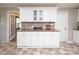 A kitchen area featuring white cabinetry and views of the living area at 2064 Elizabeth Ave, Hickory, NC 28602