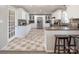 Bright kitchen featuring white cabinets, stainless steel appliances, and beautiful flooring at 2064 Elizabeth Ave, Hickory, NC 28602