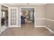 Light-filled living room showcasing wood-look flooring and an open floor plan, perfect for entertaining at 2064 Elizabeth Ave, Hickory, NC 28602