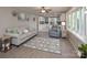 Open-concept living room leading into a modern kitchen, perfect for entertaining guests and Gathering at 2064 Elizabeth Ave, Hickory, NC 28602