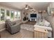 Spacious living room with a fireplace, plush seating, and natural light from the large windows at 2064 Elizabeth Ave, Hickory, NC 28602