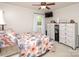 Comfortable main bedroom boasts neutral tones, a ceiling fan, and a window at 2064 Elizabeth Ave, Hickory, NC 28602