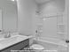 Full bathroom with shower and tub combination, plus a modern vanity at 212 Gilead Rd, Huntersville, NC 28078