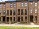 Beautiful brick townhome with charming entryways and well-maintained landscaping at 212 Gilead Rd, Huntersville, NC 28078