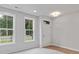 Versatile flex room with natural light, ideal for an office or den at 212 Gilead Rd, Huntersville, NC 28078