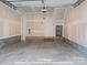 Spacious two-car garage with unfinished walls and a concrete floor at 212 Gilead Rd, Huntersville, NC 28078