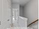 Bright hallway with white walls and carpeted floor, showcasing the upper level layout at 212 Gilead Rd, Huntersville, NC 28078