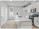 Modern kitchen with quartz countertops, stainless steel appliances, and island at 212 Gilead Rd, Huntersville, NC 28078