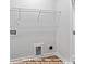Clean laundry closet featuring white walls, wire shelving, and utility hookups at 212 Gilead Rd, Huntersville, NC 28078