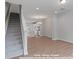 Spacious living, dining, and kitchen area with modern finishes at 212 Gilead Rd, Huntersville, NC 28078