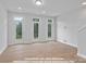 Bright living room featuring Juliet balconies, providing fresh air and natural light at 212 Gilead Rd, Huntersville, NC 28078