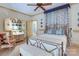 Inviting bedroom showcasing elegant decor, a decorative writing desk, and abundant natural light for a peaceful retreat at 2504 White Thorne Ln, Waxhaw, NC 28173