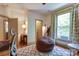Spacious bedroom featuring a comfortable bed, a large window, and a cozy seating area for relaxing and unwinding at 2504 White Thorne Ln, Waxhaw, NC 28173