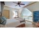 Comfortable bedroom featuring a ceiling fan and a cozy loft area, perfect for relaxation and quiet enjoyment at 2504 White Thorne Ln, Waxhaw, NC 28173