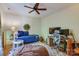 Cozy bedroom features a daybed, ceiling fan, desk and chair on a plush rug at 2504 White Thorne Ln, Waxhaw, NC 28173