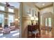 Welcoming foyer featuring hardwood floors, neutral walls, decorative paintings, and a comfortable seating area at 2504 White Thorne Ln, Waxhaw, NC 28173