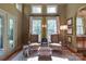 Relaxing living room with tall ceilings, lots of natural light, comfortable seating, and built-in cabinetry at 2504 White Thorne Ln, Waxhaw, NC 28173