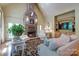 Inviting living room featuring a stone fireplace and elegant decor at 2504 White Thorne Ln, Waxhaw, NC 28173