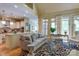 Open-concept living area featuring a large windows and beautiful hardwood floors at 2504 White Thorne Ln, Waxhaw, NC 28173