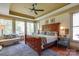Serene main bedroom with large windows and comfortable seating area at 2504 White Thorne Ln, Waxhaw, NC 28173