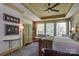 Inviting main bedroom featuring a tray ceiling, large windows, and cozy furniture at 2504 White Thorne Ln, Waxhaw, NC 28173