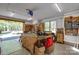 Bright workshop features an open garage door, workbench, pegboard, and large window providing natural light at 2504 White Thorne Ln, Waxhaw, NC 28173