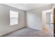 A compact bedroom with a bright window providing natural light for comfortable living at 2624 Tillman St, Monroe, NC 28112