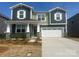 Charming two-story home featuring a two-car garage and inviting front porch at 2624 Tillman St, Monroe, NC 28112