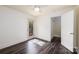 Bedroom with vinyl floors, ceiling fan, and exterior access, blending interior comfort with outdoor accessibility at 2741 Cowles Rd, Charlotte, NC 28208