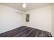Bright bedroom featuring a ceiling fan, closet, and ample natural light, creating a comfortable living space at 2741 Cowles Rd, Charlotte, NC 28208