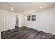 Serene bedroom includes ample natural light, neutral walls, and door to updated bath at 2741 Cowles Rd, Charlotte, NC 28208