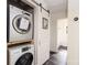 Convenient laundry area with stacked washer and dryer units, maximizing space and functionality in the home at 2741 Cowles Rd, Charlotte, NC 28208