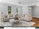 Inviting front entry with a spacious living area, neutral decor, and large windows providing natural light at 280 Gilead Rd, Huntersville, NC 28078