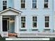 Charming covered front porch with a picket fence, offering a welcoming entrance to the townhome at 280 Gilead Rd, Huntersville, NC 28078