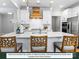 Open kitchen with stainless steel appliances, white cabinets, and a large decorative range hood at 280 Gilead Rd, Huntersville, NC 28078