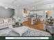 Open-concept living space with modern kitchen, island seating, and inviting living room with ample natural light at 280 Gilead Rd, Huntersville, NC 28078
