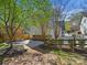 Large backyard featuring a patio, seating area, and lush landscaping at 3005 Somerset Dr, Charlotte, NC 28209