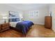 Comfortable bedroom with hardwood floors, window shutters, and tasteful decor at 3005 Somerset Dr, Charlotte, NC 28209