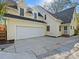 Exterior home view showing the garage, driveway, and rear entrance at 3005 Somerset Dr, Charlotte, NC 28209
