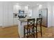 Modern kitchen with stainless steel appliances, a center island, and ample cabinet space at 3005 Somerset Dr, Charlotte, NC 28209