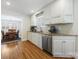 Well-appointed kitchen with white cabinets, granite countertops, and stainless steel appliances at 3005 Somerset Dr, Charlotte, NC 28209