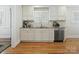 Well-lit kitchen featuring white cabinetry, stainless steel appliances, and granite countertops at 3005 Somerset Dr, Charlotte, NC 28209