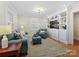Inviting living room with hardwood floors, built-in shelving, and comfortable seating at 3005 Somerset Dr, Charlotte, NC 28209