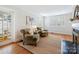 Comfortable living room with two armchairs, a fireplace, and natural light at 3005 Somerset Dr, Charlotte, NC 28209