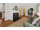 Spacious living room with a fireplace, hardwood floors, and elegant decor at 3005 Somerset Dr, Charlotte, NC 28209