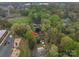 An aerial view of a single-Gathering home with a tree-filled yard, a garden and a playground nearby at 313 E Church St, Stanley, NC 28164